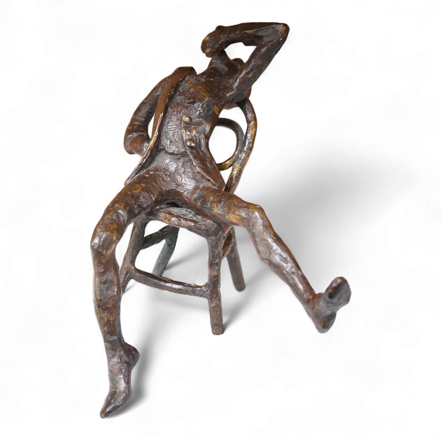 Attributed to Gerda Rubenstein (1931-2022), bronze figure of a seated man stretching, 20cm high